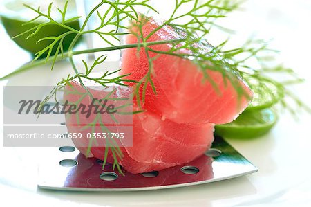 Fresh tuna fillet with slices of lime