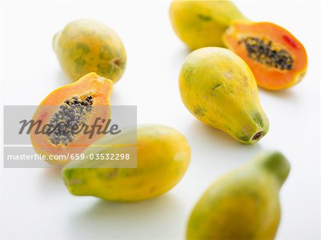 Papaya halves and whole papayas