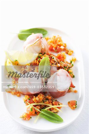 Ham-wrapped monkfish fillets with lentil salad