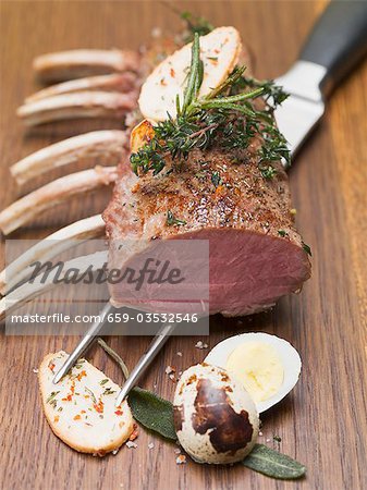 Rack of lamb with herbs, fried potatoes and quail's egg