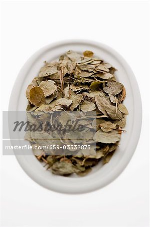 Dried blueberry leaves in bowl from above