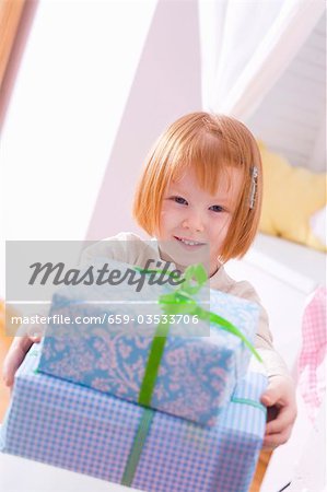 Little girl with Christmas parcels