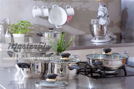 Assorted stainless steel pans in a kitchen