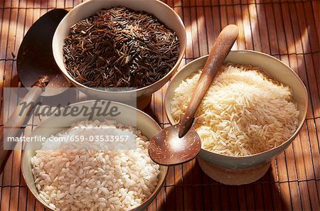 Three different types of rice in bowls