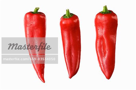 Three red pointed peppers