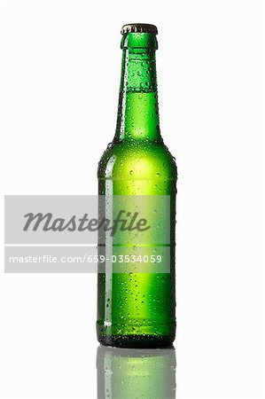 Green bottle of beer with drops of water Green bottle of beer with drops of water