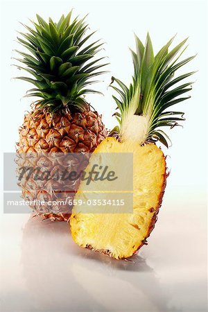 One whole pineapple and half a pineapple