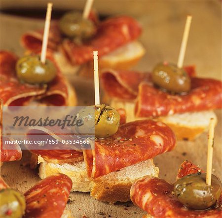 Canapés with chorizo and green olives