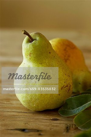 Green Pears on Wooden Table