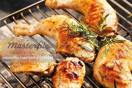 Chicken legs with rosemary on barbecue