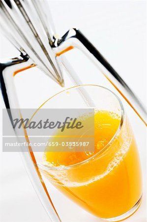 Orange juice with citrus squeezer