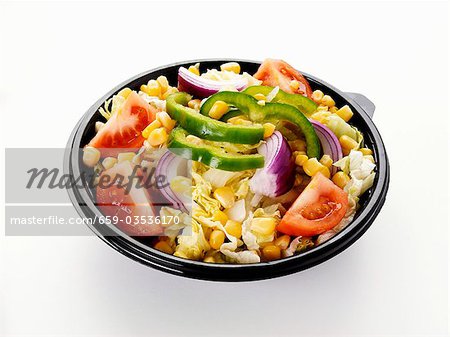 Mixed salad in a plastic container