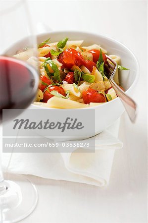 Penne with cherry tomatoes, basil and garlic