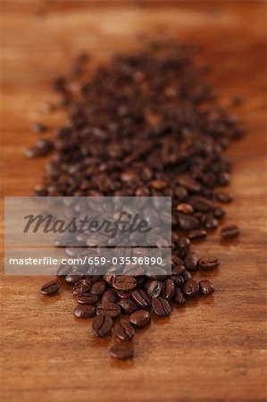 Coffee beans on wooden table