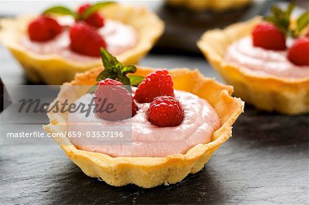 Several raspberry tarts
