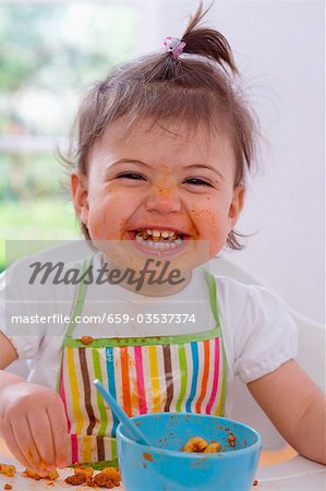 Girl eating pasta with bolognese sauce
