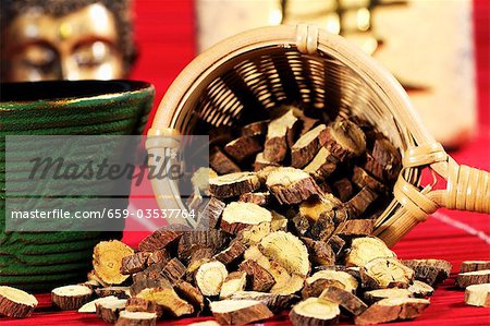 Dried Ural liquorice root in tea strainer for making tea