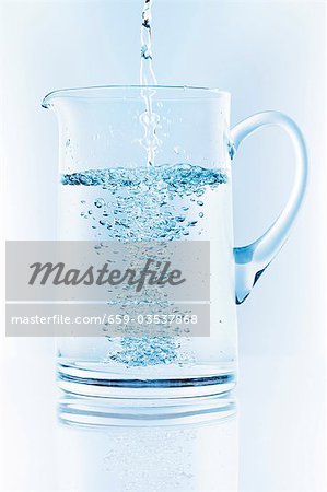 Pouring water into jug