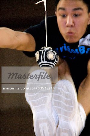 Boy doing Two-Foot High Kick 2006 Senior Native Youth Olympic Games Alaska Anchorage Sullivan Arena