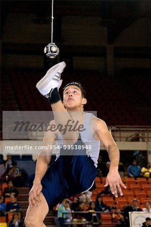 Boy doing One-Foot High Kick 2006 Senior Native Youth Olympic Games Alaska Anchorage Sullivan Arena