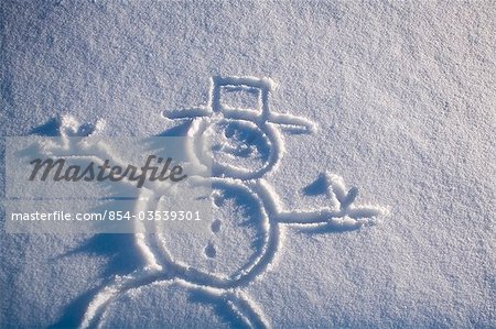 Drawing of snowman in new fresh snow Alaska winter