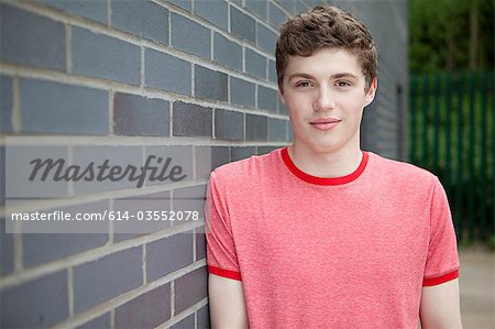 Young man by wall
