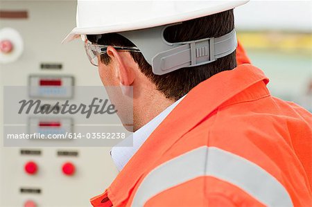 Engineer looking at control panel