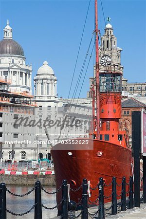 Lightship near the renovated Albert Docks with a view towards the The Liver and the Port of Liverpool Buildings, Liverpool, Merseyside, England