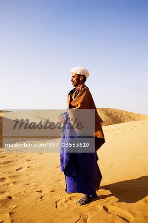 Man standing in a desert, Thar Desert, Jaisalmer, Rajasthan, India