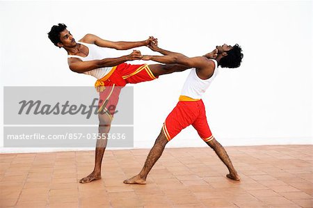 Two people practicing kalarippayattu