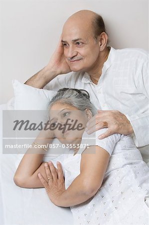 Couple lying on the bed and day dreaming
