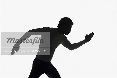 Silhouette of a male athlete running