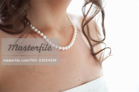 Close-up of Bride Wearing Pearl Necklace