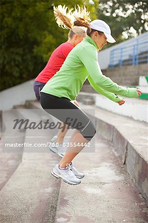 Women Jumping up Steps, Green Lake Park, Seattle, Washington, USA