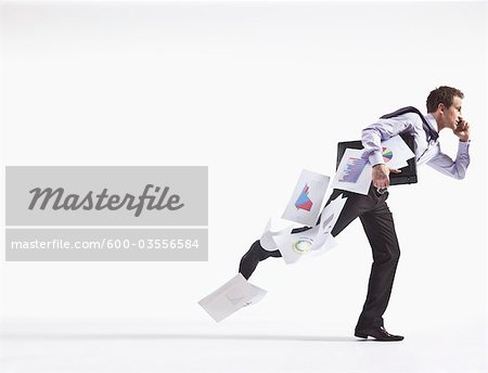 Hurried Businessman Dropping Papers