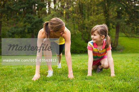 Mother and Young Daughter Exercising in the Park, Portland, Oregon, USA
