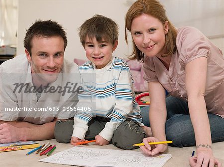 Parents on Floor Coloring With Son