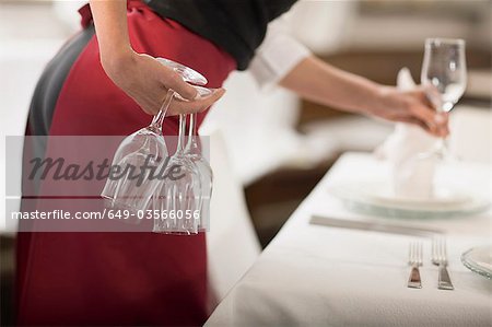 Waitress laying the table