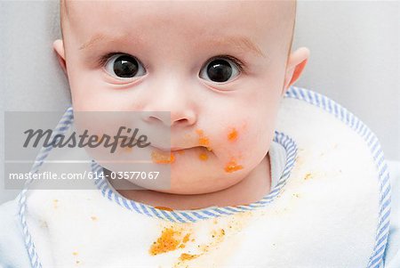 Baby with food on his face