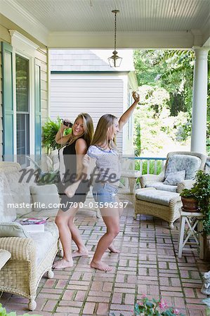 Teenage Girls Dancing on Front Porch