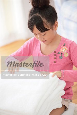 Japanese Girl Folding Laundry