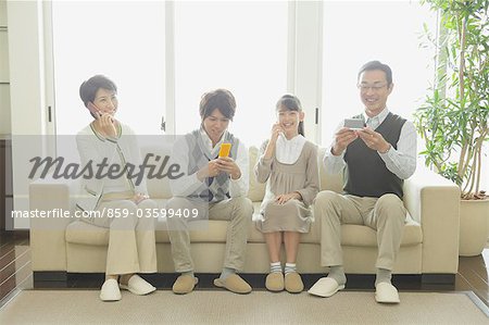 Family Talking On The Phone