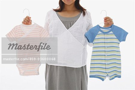 Woman Displaying Baby Clothes