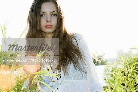 Woman Standing in Long Grass