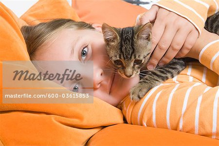 Little Girl Holding Kitten, Dusseldorf, North Rhine-Westphalia, Germany