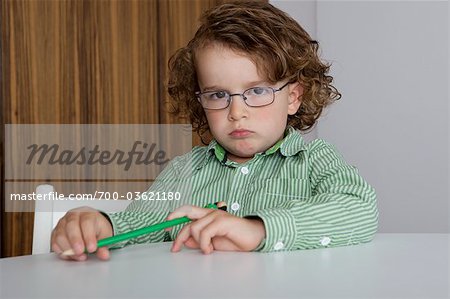 Portrait of Little Boy Holding Pencil
