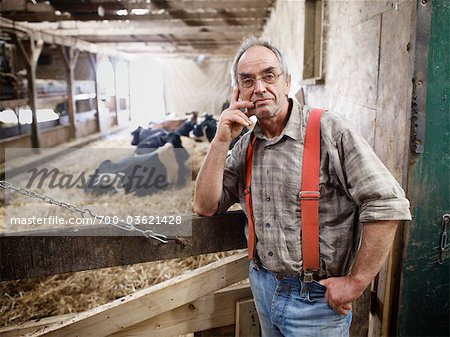 Portrait of Farmer in Barn, Ontario, Canada