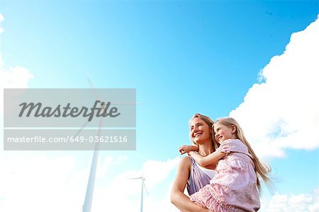 Mother and daughter at wind turbine