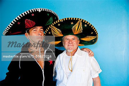 portrait of two men wearing sombreros