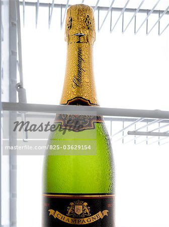 A bottle of champagne in the refrigerator